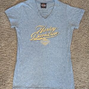 Women's Size Medium Harley-Davidson Heather Blue T Shirt With Yellow Lettering.